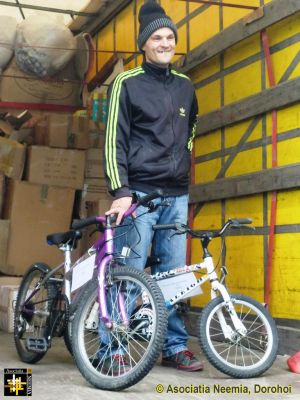 Unloading at Dealu Mare
Mihai Gradinariu with two bikes for his children
Keywords: Oct13;Load13-07;