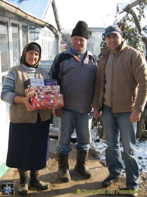 Christmas Gift Boxes
Beni (r) giving Christmas gifts to a village couple.
Keywords: RBdec12;Dec12;Fam-Tataraseni;Jbox12;GChoice1303m12