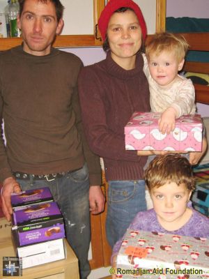 Christmas Gift Boxes
Cristi & Dana Matei receiving Christmas boxes for their family.
Keywords: RBdec12;Dec12;Fam-Prelipca;Jbox12;GChoice1303m12