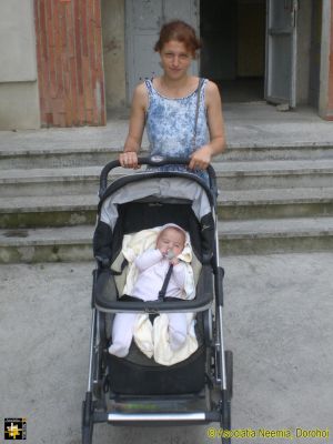 Donated Pushchair
Adriana Motoc's new baby gets a ride.
Keywords: Aug16;Fam-Dorohoi