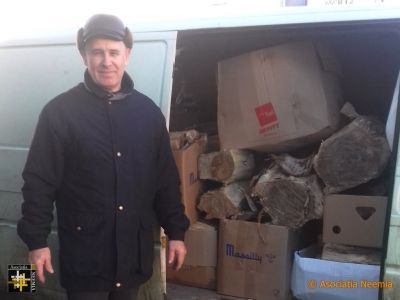 Warmth comes in boxes
Iulian prepares to deliver firewood to needy families
Keywords: dec19;wood;pub2001j
