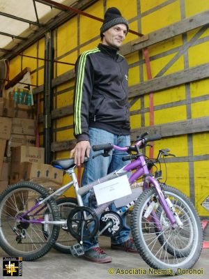 Unloading at Dealu Mare
Mihai Gradinariu with two bikes for his children
Keywords: Oct13;Load13-07;